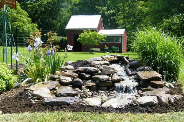 23 Absolutely Stunning Pondless disappearing waterfall designs