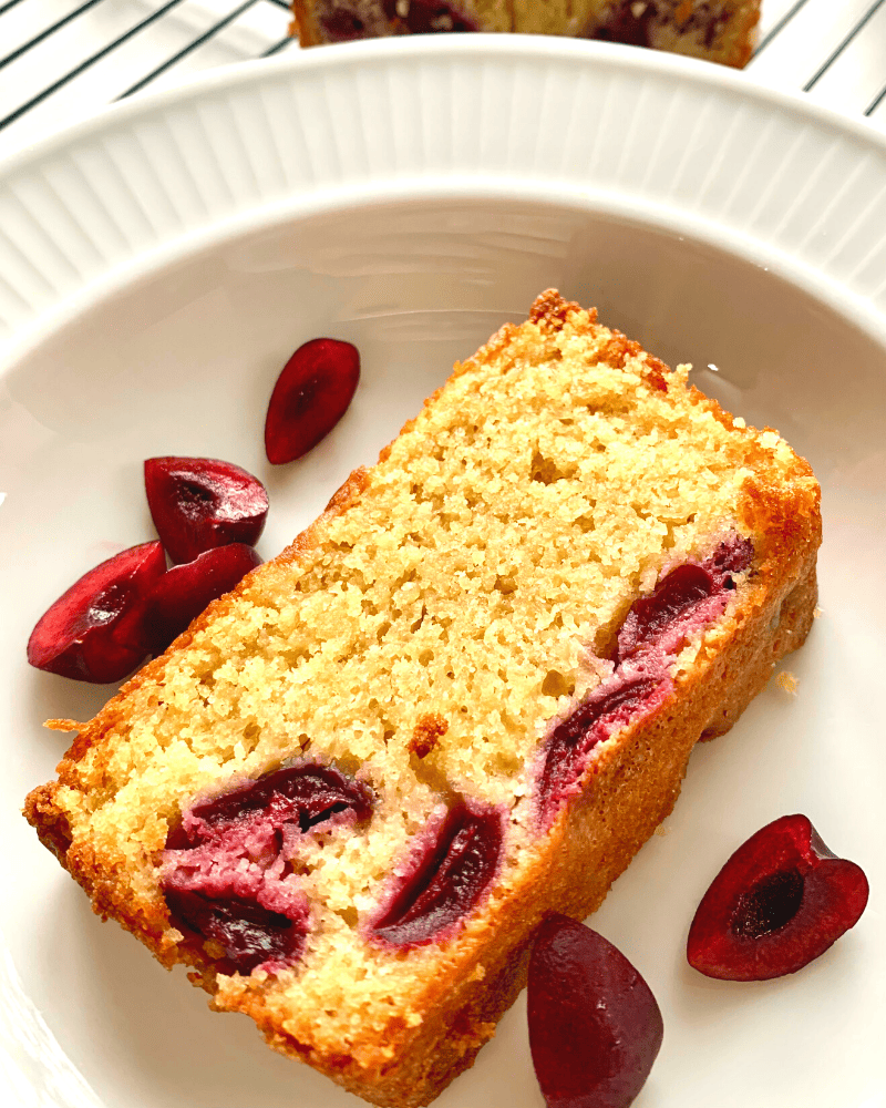 a slice of cherry loaf cake 